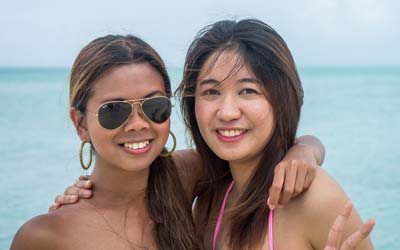 A photo of two beautiful Filipina women by the beach