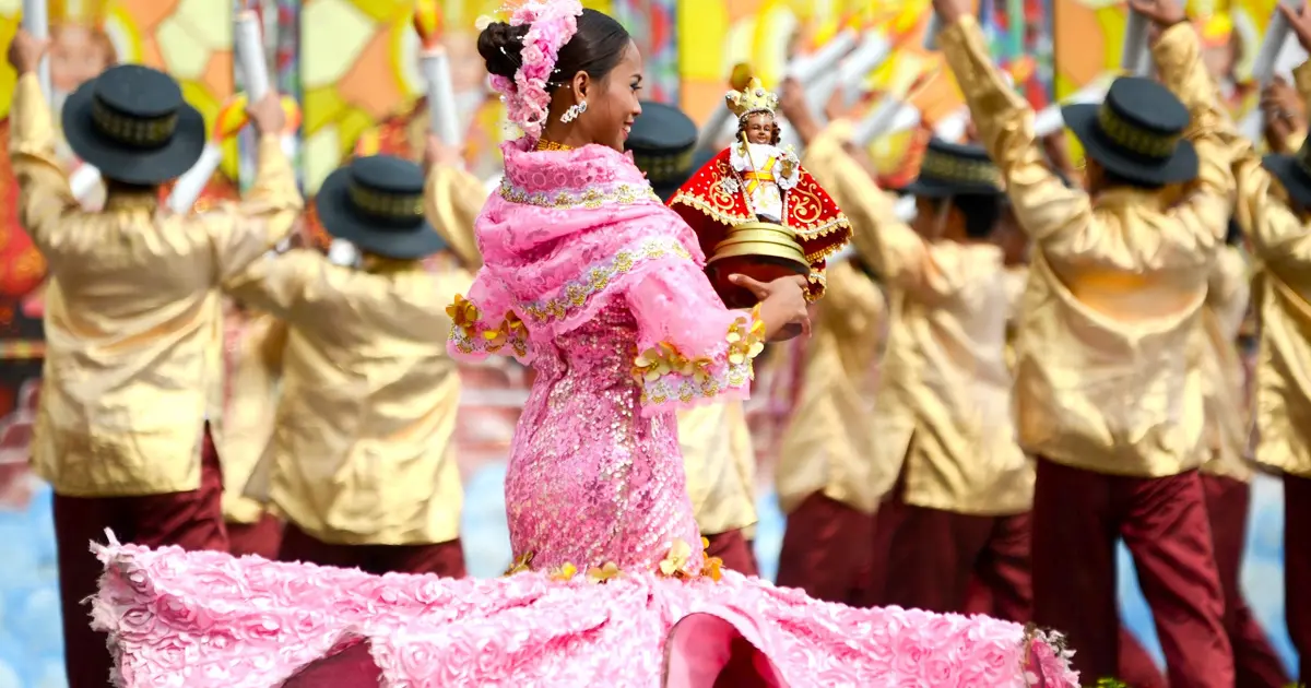 A woman parading the Santo Niño during Sinulog, the most popular festival in the Philippines